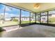 Covered lanai providing outdoor views of the backyard and adjacent neighborhood homes at 6124 Green View Dr # 139, Sarasota, FL 34231