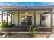 Enjoy this screened patio overlooking a lush garden and featuring a sliding glass door to the interior at 6124 Green View Dr # 139, Sarasota, FL 34231