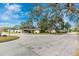 Street view of residential neighborhood with landscaped yards and mature trees at 6124 Green View Dr # 139, Sarasota, FL 34231
