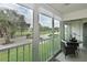 Balcony with a beautiful view of a golf course and seating area at 6501 Stone River Rd # 205, Bradenton, FL 34203