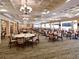 Spacious banquet hall featuring elegant chandeliers and seating for large gatherings at 6501 Stone River Rd # 205, Bradenton, FL 34203