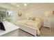 Bright bedroom features a large window, and dresser at 6501 Stone River Rd # 205, Bradenton, FL 34203
