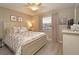Comfortable bedroom with a cozy bed, neutral tones, and plenty of natural light at 6501 Stone River Rd # 205, Bradenton, FL 34203