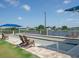 Outdoor bocce ball courts with seating, lake views, and shaded seating areas at 6501 Stone River Rd # 205, Bradenton, FL 34203