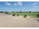 The driving range features multiple hitting stations and open green space for practice at 6501 Stone River Rd # 205, Bradenton, FL 34203
