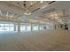 Spacious event space with large windows offering beautiful views and elegant chandeliers at 6501 Stone River Rd # 205, Bradenton, FL 34203
