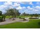 Scenic view of the lush green golf course under a bright blue sky with fluffy clouds at 6501 Stone River Rd # 205, Bradenton, FL 34203