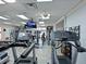 Well-equipped gym featuring treadmills, weights, and mounted televisions for a complete workout experience at 6501 Stone River Rd # 205, Bradenton, FL 34203
