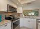 Close-up of the modern kitchen, showcasing granite countertops and stainless steel appliances at 6501 Stone River Rd # 205, Bradenton, FL 34203