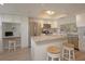Bright kitchen with stainless steel appliances, granite countertops, and ample counter space at 6501 Stone River Rd # 205, Bradenton, FL 34203