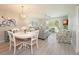 Inviting living space featuring slider doors to sunroom, and neutral decor at 6501 Stone River Rd # 205, Bradenton, FL 34203