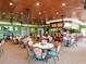 Restaurant featuring cozy seating arrangements and a fully-stocked bar area for residents at 6501 Stone River Rd # 205, Bradenton, FL 34203