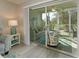 Cozy sunroom featuring a comfortable seating area and views of the lush outdoor scenery at 6501 Stone River Rd # 205, Bradenton, FL 34203