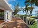 Inviting balcony features seating and stunning waterfront views from this lovely home at 691 Linley St, Longboat Key, FL 34228