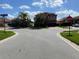 Street view with community street sign and single Gathering homes with well maintained lawns at 11936 Frost Aster Dr, Riverview, FL 33579