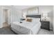 Calming bedroom suite featuring plush bed, soft textures, serene decor, and sophisticated color scheme at 128 Sequoyah Dr, Port Charlotte, FL 33954