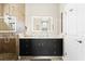 Bright bathroom featuring a glass shower and modern vanity with decorative lighting at 13038 Prima Dr, Bradenton, FL 34211