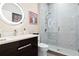 Elegant bathroom with a floating vanity, a lighted mirror, and a glass-enclosed shower with rain shower head at 13038 Prima Dr, Bradenton, FL 34211