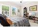 Bedroom featuring natural light, a ceiling fan, and a comfortable bed with a decorative throw blanket at 13038 Prima Dr, Bradenton, FL 34211