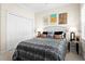 Comfortable bedroom with neutral walls, carpet, and a soft bed with decorative pillows and lamps on each side at 13038 Prima Dr, Bradenton, FL 34211