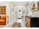 Foyer featuring marble floors, elegant lighting, and a decorative cabinet at 13038 Prima Dr, Bradenton, FL 34211