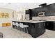 Bright kitchen boasts a spacious island with barstool seating, modern pendant lighting, and stylish cabinetry at 13038 Prima Dr, Bradenton, FL 34211