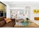 Comfortable living room with modern furniture, sleek shelving, and a cozy atmosphere at 13038 Prima Dr, Bradenton, FL 34211