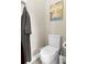 Simple powder room with a modern white toilet and neutral wall color at 13038 Prima Dr, Bradenton, FL 34211