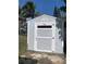 Outdoor storage shed with painted exterior and window for added light at 1409 2Nd E Ave, Bradenton, FL 34208