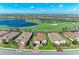 Scenic aerial view of a home encircled by a golf course and shimmering lakes at 15209 Montello Way, Bradenton, FL 34211