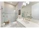 Bright bathroom with a walk-in shower, vanity, and modern fixtures at 15209 Montello Way, Bradenton, FL 34211