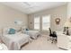 Cozy bedroom with natural light, neutral walls, and a desk area at 15209 Montello Way, Bradenton, FL 34211