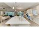 Spacious kitchen with a large island, stainless steel appliances, and a view of the living area at 15209 Montello Way, Bradenton, FL 34211