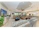 Spacious living room offers comfortable seating, golf course views, and an open layout to the kitchen at 15209 Montello Way, Bradenton, FL 34211