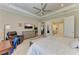 Spacious main bedroom featuring a king-size bed, sitting area, and an ensuite bathroom at 15209 Montello Way, Bradenton, FL 34211