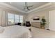 Bright main bedroom with a ceiling fan, tray ceiling, and a full size dresser at 15209 Montello Way, Bradenton, FL 34211