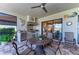 Inviting outdoor kitchen with stainless steel grill and dining area on the lanai at 15209 Montello Way, Bradenton, FL 34211
