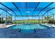 Beautiful pool and spa with serene golf course views, enhanced by a screened enclosure at 15209 Montello Way, Bradenton, FL 34211