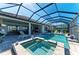 Inviting pool and spa area with a screened enclosure, perfect for outdoor relaxation at 15209 Montello Way, Bradenton, FL 34211