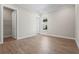 Neutral bedroom featuring tile floors, white trim, closet, and a window at 16435 Umbria Pl, Bradenton, FL 34211