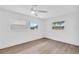 This bright bedroom features hardwood floors and is a blank canvas ready for your personal touch at 1950 Fairview Dr, Englewood, FL 34223