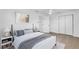 This bedroom offers a modern bed, neutral decor, and ample storage for a peaceful sanctuary at 1950 Fairview Dr, Englewood, FL 34223