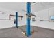 Spacious garage with car lifts and plenty of room for working on vehicles or storing equipment at 1950 Fairview Dr, Englewood, FL 34223
