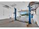 Spacious garage with car lifts and an open garage door showcasing the lovely neighborhood at 1950 Fairview Dr, Englewood, FL 34223