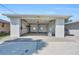 Spacious garage with high ceilings, car lifts and ample room for storage or a workshop at 1950 Fairview Dr, Englewood, FL 34223