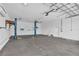 This spacious garage has high ceilings, car lifts, and plenty of room for storage or a workshop at 1950 Fairview Dr, Englewood, FL 34223