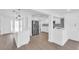 Open concept kitchen with stainless appliances, island and eat in bar at 1950 Fairview Dr, Englewood, FL 34223