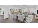Bright living and dining area featuring modern furnishings, hardwood floors, and natural light at 1950 Fairview Dr, Englewood, FL 34223