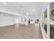 Spacious and bright living room featuring tile flooring, recessed lighting, and lots of natural light at 1950 Fairview Dr, Englewood, FL 34223