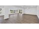 Expansive living space with bright windows and luxury vinyl plank flooring at 1950 Fairview Dr, Englewood, FL 34223